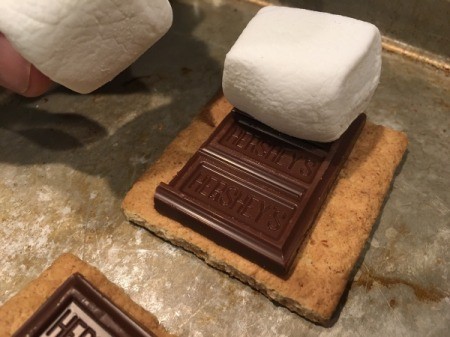 Baked Smores - Adding marshmallows on top of chocolate bar.