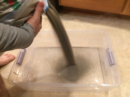 Indoor Sandbox - pouring in sand