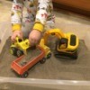 Indoor Sandbox - child playing with trucks in sandbox