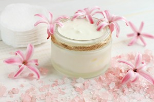 Jar of face cream with pink flowers