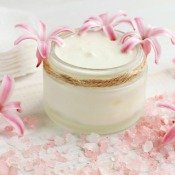 Jar of face cream with pink flowers