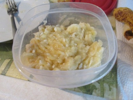 Mashed bananas in a container.