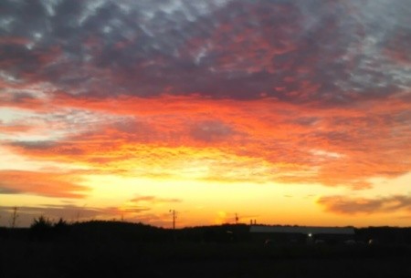 yellow and orange sunset with clouds