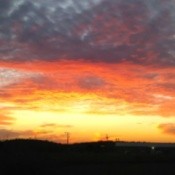 yellow and orange sunset with clouds