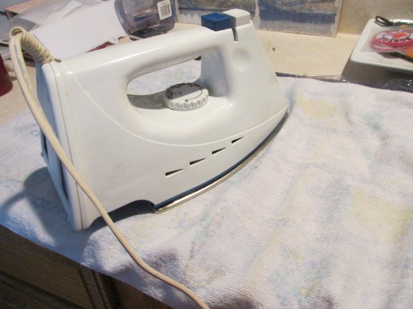 ironing the leaves and wrap covered with a  towel