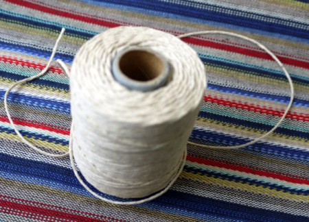 spool of plain white string