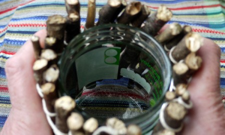 fitting the twigs around the jar