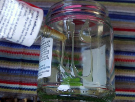 putting glue on the jar