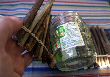 wrapping twigs around the jar
