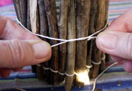 tying a temporary bit of string around the twigs until glue dries