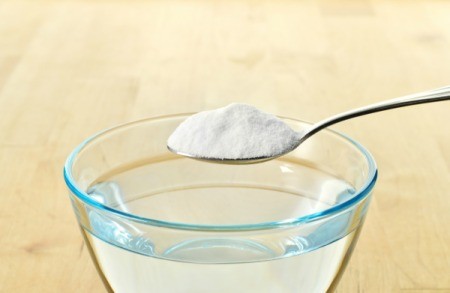 A spoon of baking soda for use as an antacid