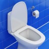 White toilet against blue tile floor and wall