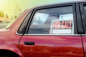 Close up of car rear window with For Sale Sign