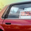 Close up of car rear window with For Sale Sign