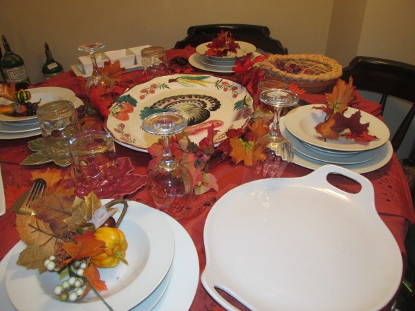 A table set with Thanksgiving dishes.