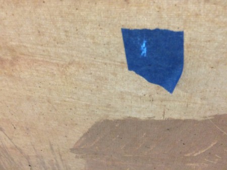 blue painter's tape on back of canvas
