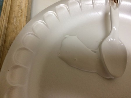 white ceiling paint on paper plate