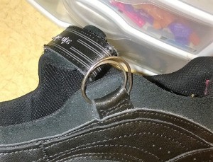 A shoe that has been fixed with a key ring.