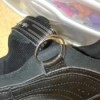 A shoe that has been fixed with a key ring.