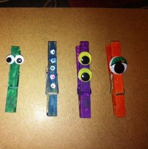 four different monster clothes pins