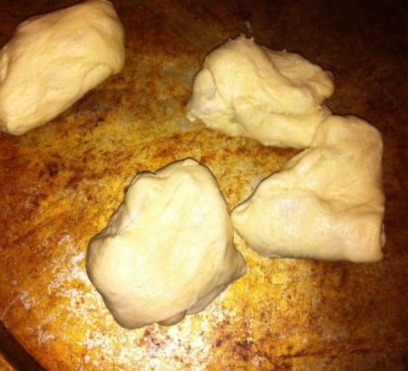 Crescent Pizza Rolls - uncooked rolls on a cookie sheet