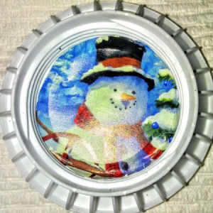 bottle cap with snowman picture inside