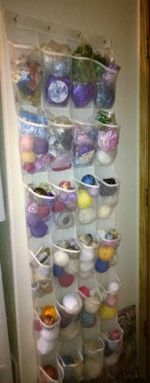 craft supplies stored in back of door shoe storage bag