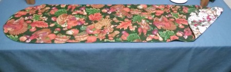 table runner on table with one corner flipped up to show other side