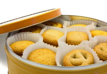 A cookie tin with butter cookies.