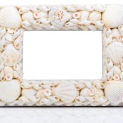 A picture frame made from seashells.