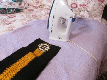 Adding a sports logo to the bottom of a striped scarf.