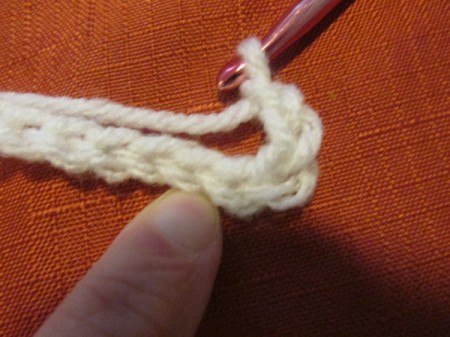 A crocheted chain in white yarn.