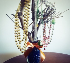 branch and jar jewelry tree with necklaces