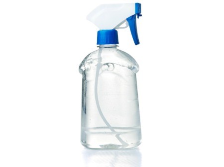 A bottle of window cleaner containing vinegar and cornstarch.