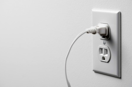 A cord plugged into an electrical outlet.