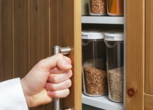 Someone opening the door on their cupboard.