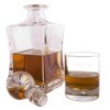A whiskey decanter with a stopper.