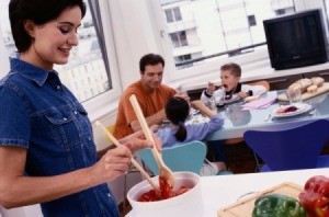 A mother cooking dinner for her family.