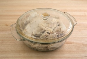 A bowl of cooked turkey pieces.