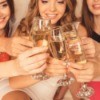 Woman toasting the bride at a bachelorette party.