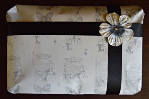 A hand stamped gift wrapped package.