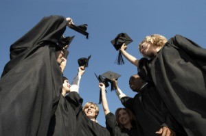 A group of graduates in cap and gown.