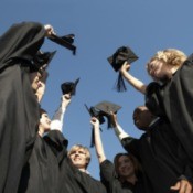 A group of graduates in cap and gown.