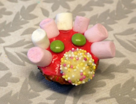 A decorated cupcake at a party.