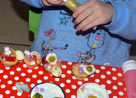 Decorating cupcakes.