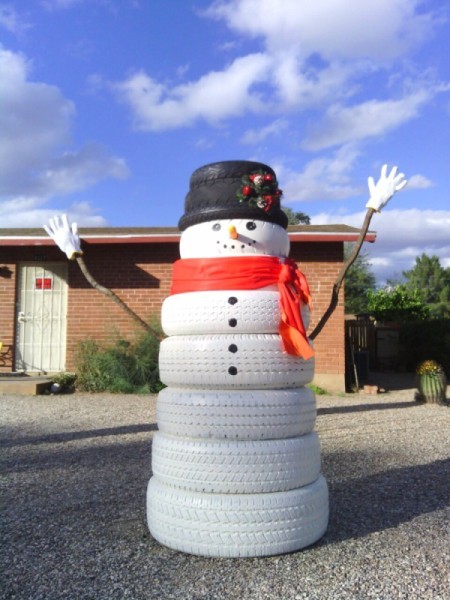 large tire snowman in desert yard