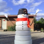 large tire snowman in desert yard
