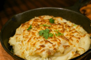 A dish of cheesy mashed potatoes.
