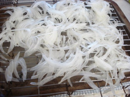 sliced onions in pan