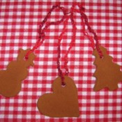 Three ornaments made from cinnamon and applesauce.